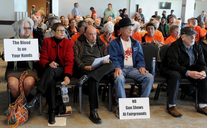 People wait to speak during a Ventura County Fairgrounds board meeting in Ventura. The board discussed whether to implement new rules for gun shows at the fairgrounds or whether to continue to allow them.