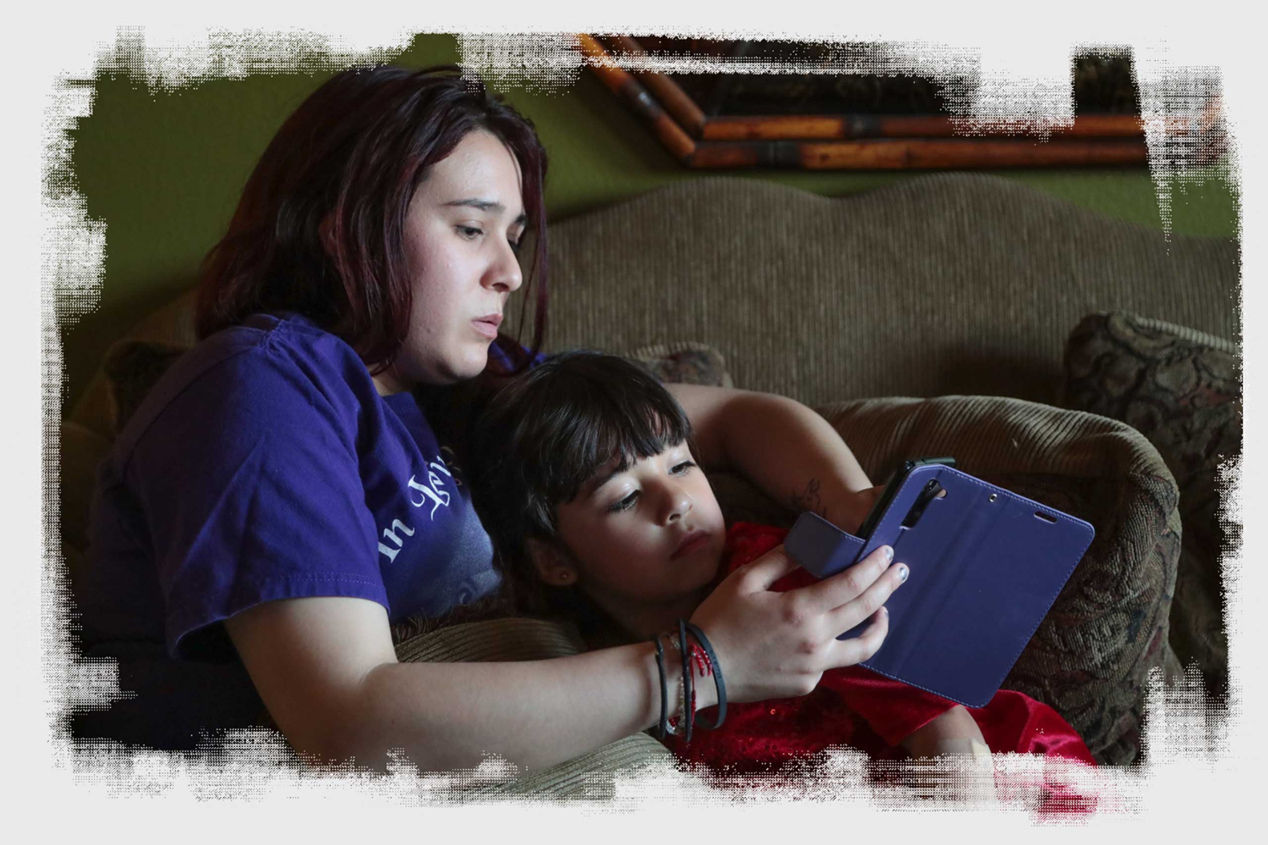 Michelle Dugan-Delgado sits with her daughter, Marie, at her home in Coachella on April 27, 2018.