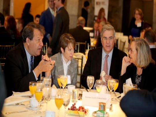 Westchester County Executive George Latimer, left, speaks with Leslie Gordon of Feeding Westchester, John Ravitz, Executive Vice President of the Westchester Business Council, and Susan Fox of the Westchester Institute for Human Development during the annual breakfast of the Westchester Business Council at Tappan Hill in Tarrytown Nov. 28, 2018. Latimer was the guest speaker at the breakfast.