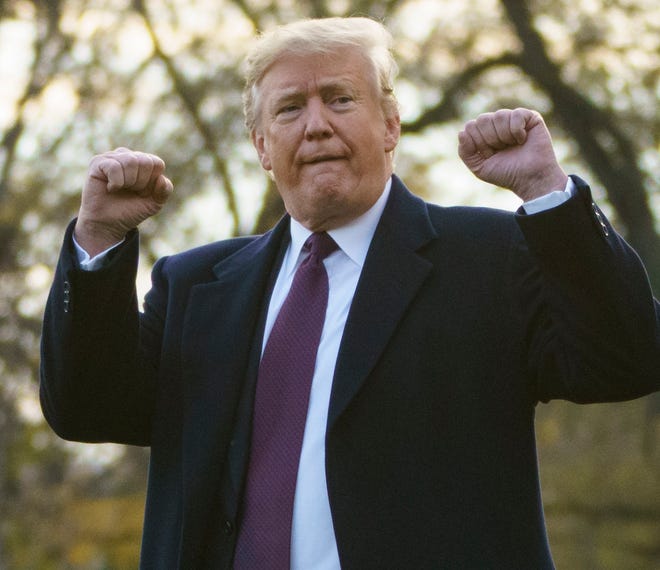 President Donald Trump gestures as he walks to Marine One after speaking to media at the White House in Washington, Tuesday, Nov. 20, 2018, for the short trip to Andrews Air Force Base en route to Palm Beach International Airport, in West Palm Beach, Fla., and on to and onto Mar-a-Lago. (AP Photo/Carolyn Kaster) ORG XMIT: DCCK137