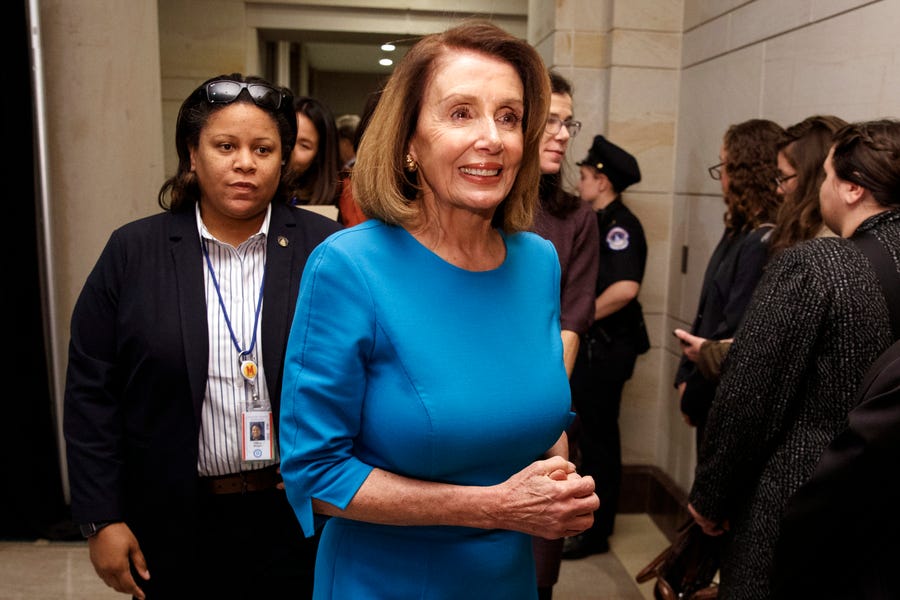 House Minority Leader Nancy Pelosi, D-Calif., walks from Democratic Caucus leadership elections on Capitol Hill in Washington on Wednesday. Pelosi won support from a majority of Democrats to be House Speaker
