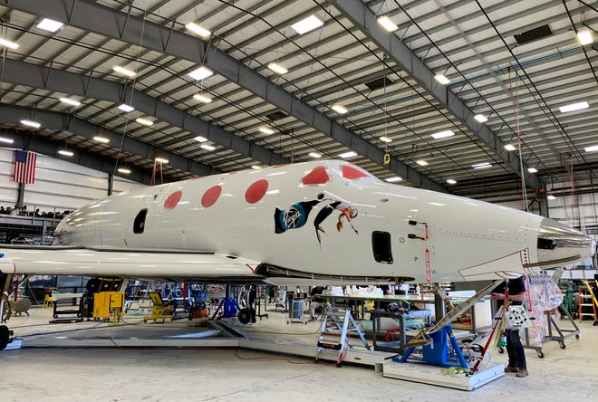 Virgin Galactic's VSS Unity undergoes checks before a test flight at the company's private facility in Mojave, California.