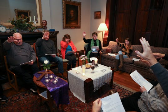 Mary Sue Barnett, center, leads a service at the First Unitarian Church.  She is a woman priest who was ordained by the Association of Roman Catholic Women Priests.  
Nov. 26, 2018