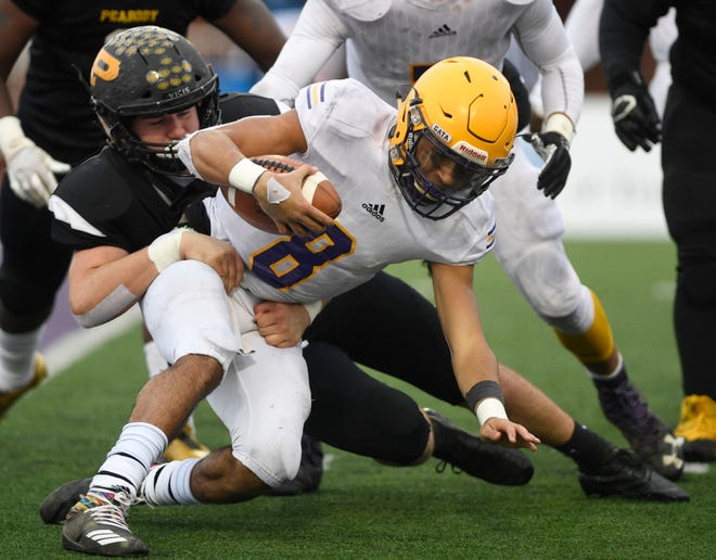 Trousdale's Keyvont Baines (8) is brought down by a Peabody defender in the third quarter during the Class 2A BlueCross Bowl state championship at Tennessee Tech's Tucker Stadium in Cookeville, Tenn., on Thursday, Nov. 29, 2018.