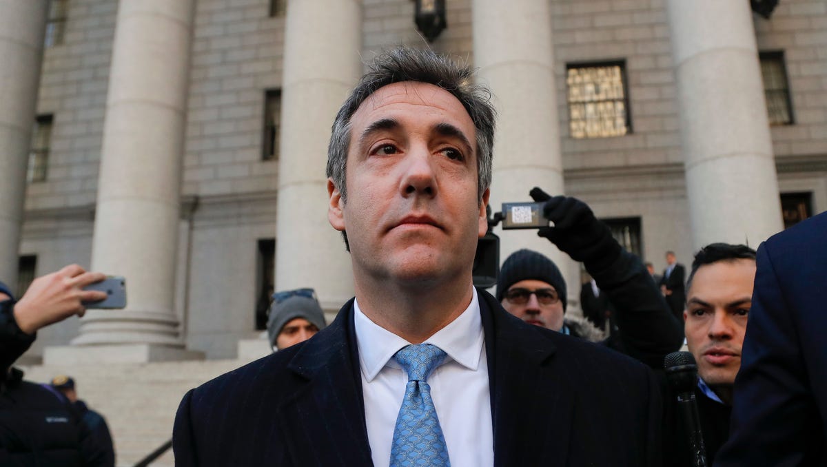 Michael Cohen walks out of federal court Thursday in New York, after pleading guilty to lying to Congress about work he did on an aborted project to build a Trump Tower in Russia. Cohen told the judge he lied about the timing of the negotiations and other details to be consistent with Trump's "political message."