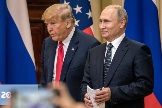 President Donald Trump and Russian President Vladimir Putin arrive to waiting media during a joint press conference after their summit on July 16, 2018, in Helsinki, Finland.
