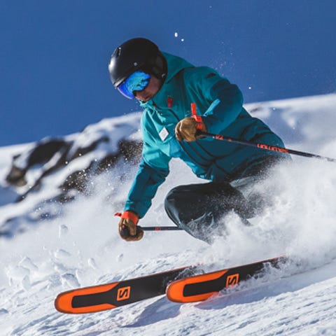 An instructor shows how to ski the high alpine ter