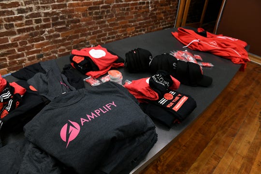 Brand promotional materials for Amplify are located in the new Market Square office space. Amplify is a technology company involved in cryptocurrency.