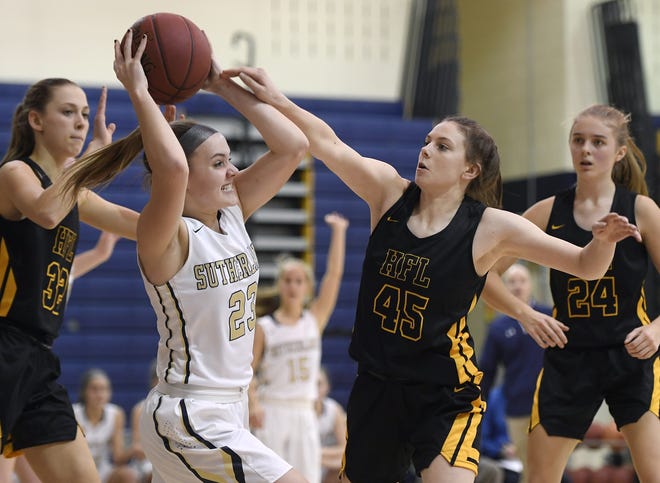 Pittsford Sutherland's Abby Creary, left, looks to pass while defended by HF-L's Morgan Bellavia during a regular season game played at Pittsford Sutherland High School on Thursday, Nov. 29, 2018. Pittsford Sutherland beat Honeoye Falls-Lima in overtime 53-47.