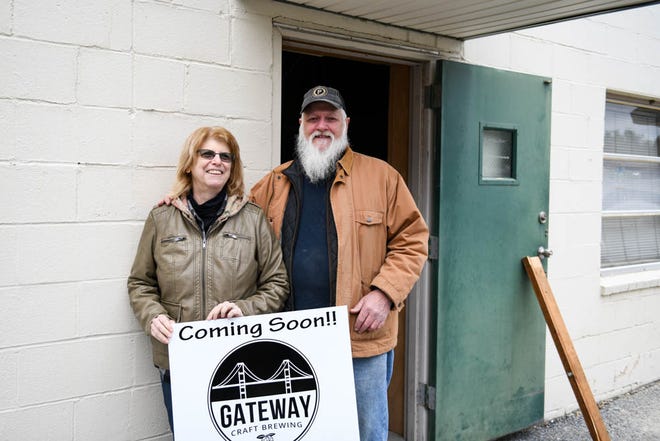 Lynn and Tim Gavin of Hebron pose in front of the site of their new brewery, "Gateway Craft Brewing" in Salisbury.