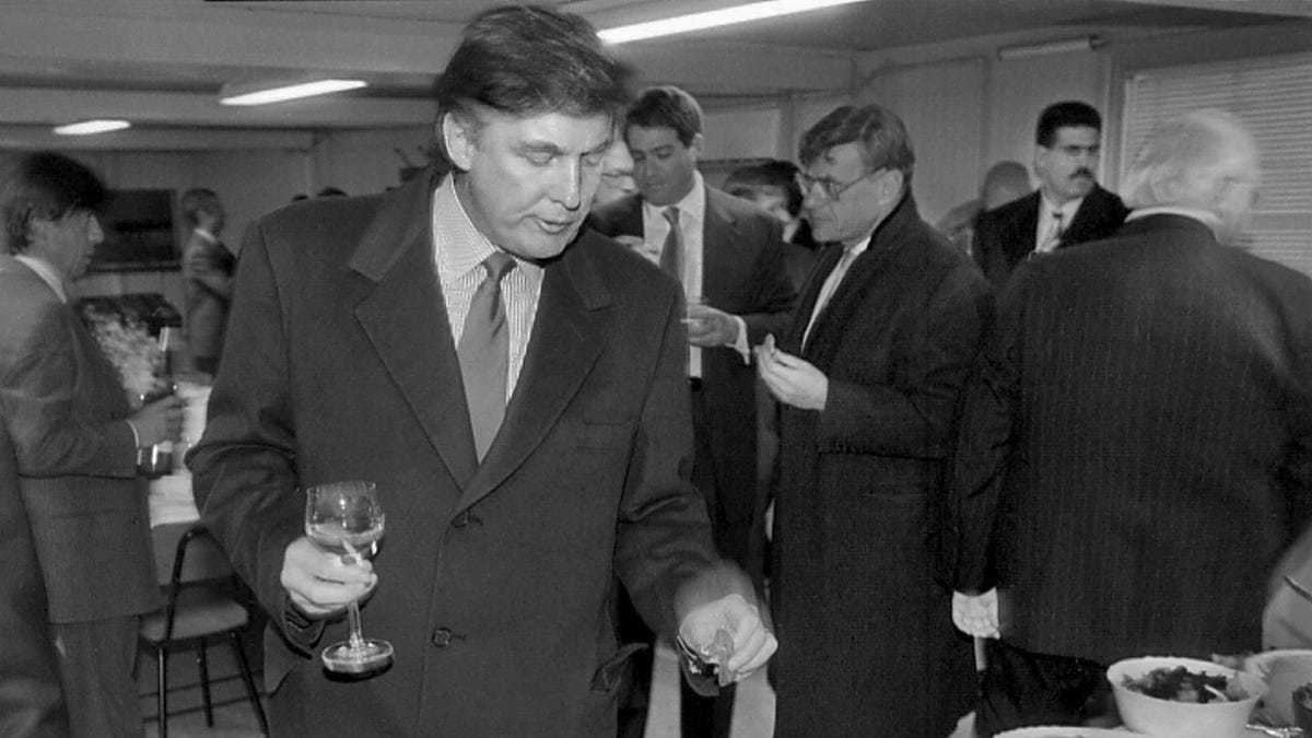 Donald Trump visits a reception as he checks out sites in Moscow for luxury residential towers, on Nov. 5, 1996.