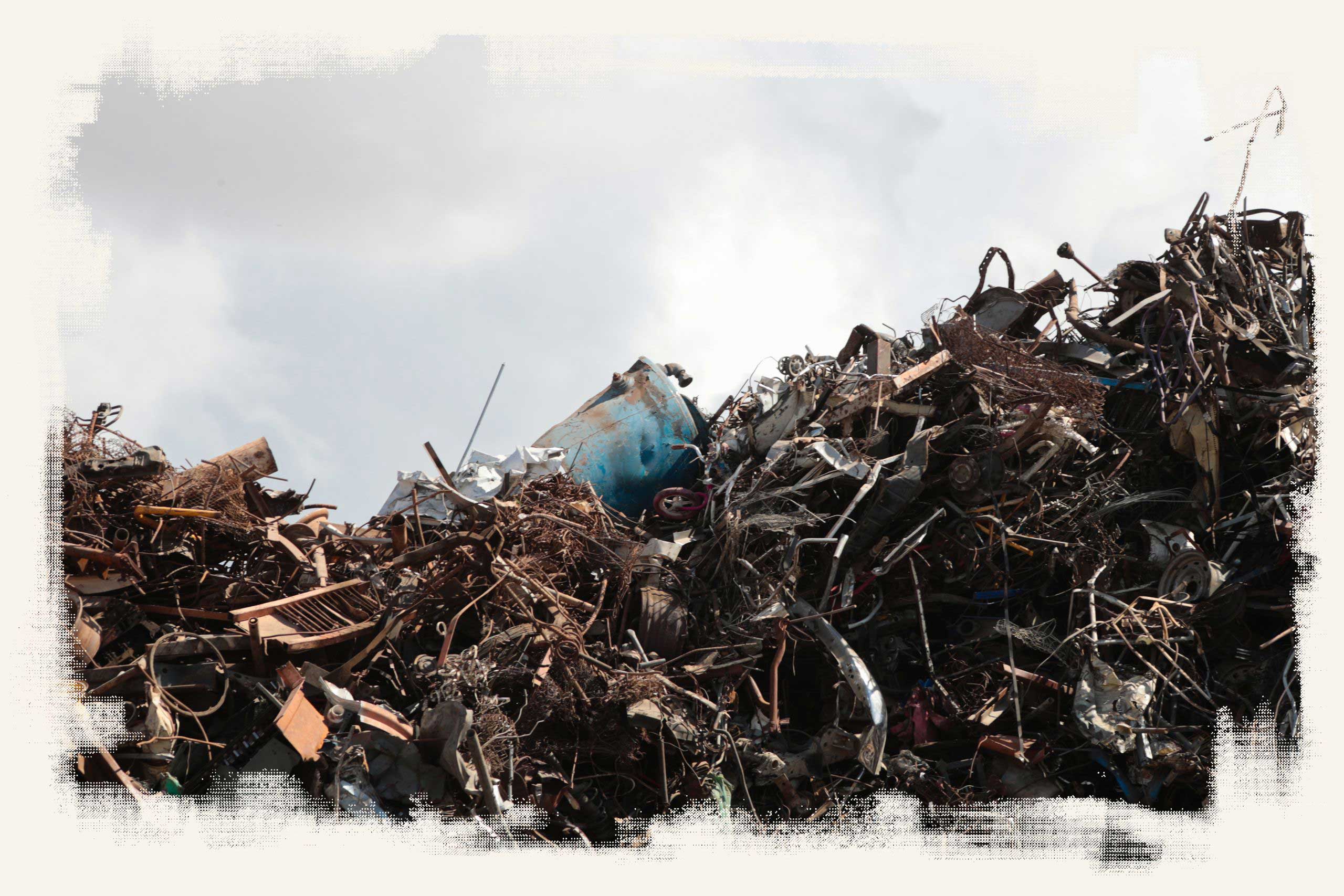 A heap of scrap metal is piled against a wall at the Grupo Simec steel mill near Mexicali.