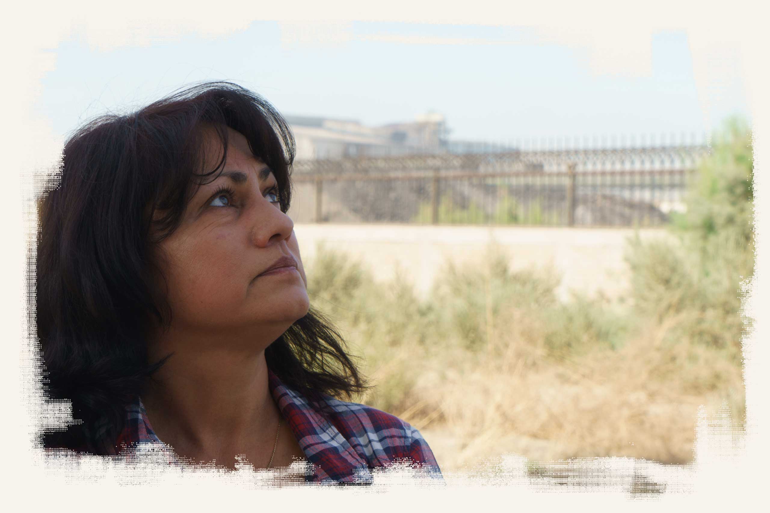 Blanca Ramírez stands outside the Grupo Simec steel mill near Mexicali. She says the plant has been spewing more smoke lately.