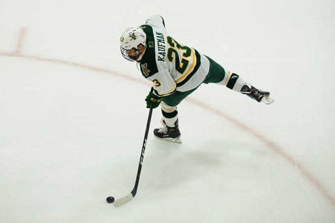 Vermont forward Max Kaufman (23) shoots the puck during warm ups during the men's hockey game between the Mine Black Bears and the Vermont Catamounts at Gutterson Field House on Friday night November 30, 2018 in Burlington.