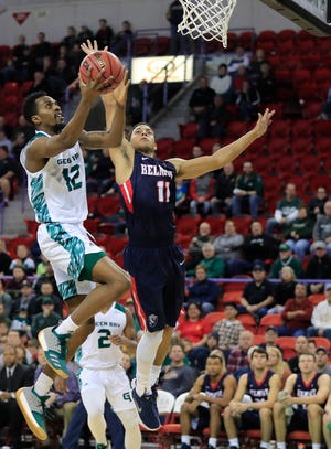 Green Bay Phoenix forward Josh McNair (12) drives to the basket against Belmont Bruins guard Kevin McClain (11) in a NCAA basketball game at the Resch Center on Saturday, December 1, 2018 in Ashwaubenon, Wis.