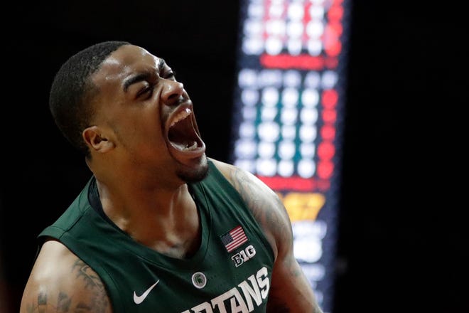 Michigan State forward Nick Ward reacts after dunking against Rutgers during the second half of an NCAA college basketball game, Friday, Nov. 30, 2018, in Piscataway, N.J.