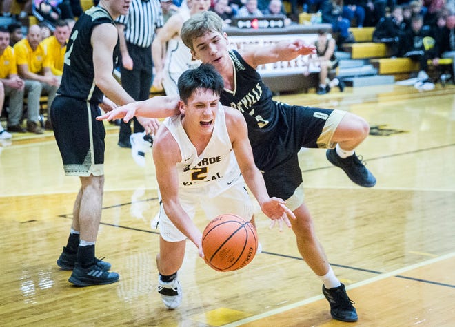 Monroe Central's Jackson Ullom is fouled by Daleville's Connor Fleming during their game at Monroe Central High School Friday, Nov. 30, 2018. 