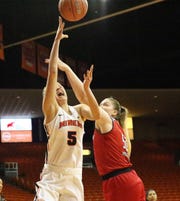 Zuzanna Puc, 5, of UTEP drives for a layup against Madison Heckert, 50, of Arkansas State in a recent game.