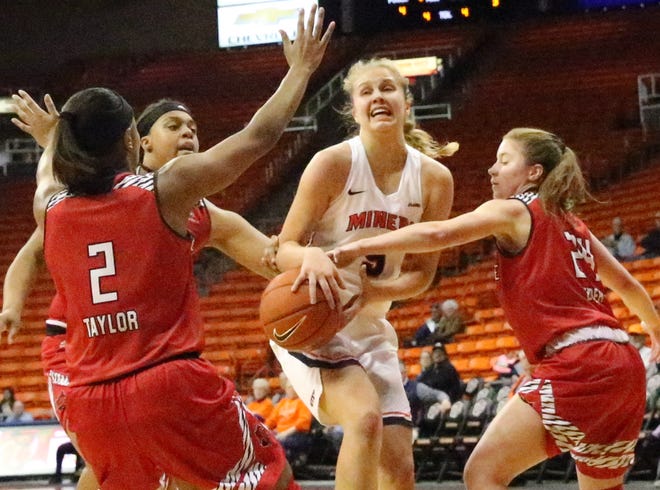 UTEP forward Zuzanna Puc, center, gets the ball stripped by Arkansas State while driving for a layup in the Don Haskins Center.