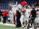 Northern Illinois defensive tackle Weston Kramer dumps water on coach Rod Carey during the second half of the MAC championship game against Buffalo.