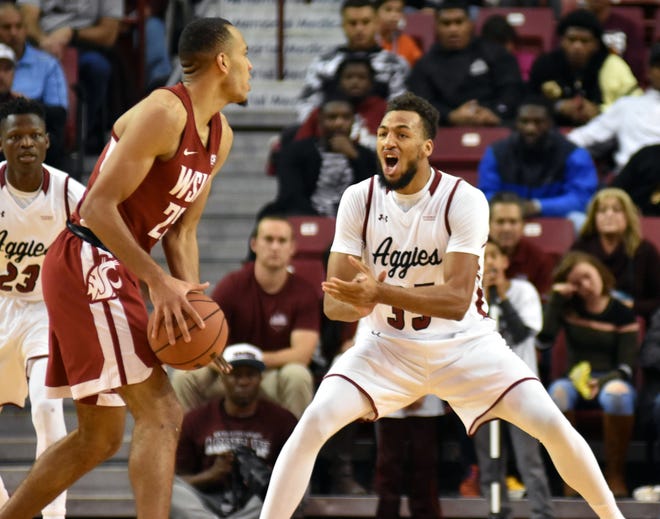 New Mexico State's Johnny McCants gets the defense going against the Washingston State Cougars in the Pan Am on Saturday night.