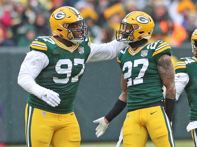 Green Bay Packers defensive back Josh Jones (27) and nose tackle Kenny Clark (97) celebrate a defensive stop against the Arizona Cardinals Sunday, December 2, 2018 at Lambeau Field in Green Bay, Wis.
Jim Matthews/USA TODAY NETWORK-Wis