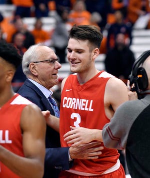 Dec 1, 2018; Syracuse, NY, USA; Syracuse Orange head coach Jim Boeheim greets his son Jimmy Boeheim (3) a forward for the Cornell Big Red after the game at the Carrier Dome. Mandatory Credit: Mark Konezny-USA TODAY Sports