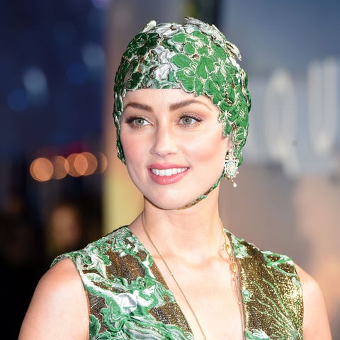 Amber Heard wore a very fitting couture swim cap...