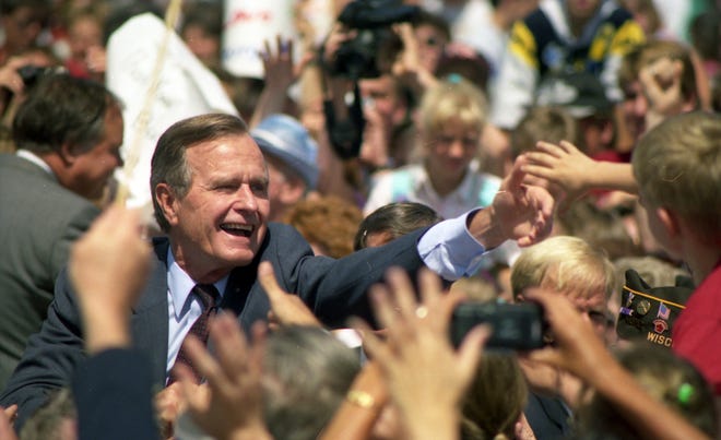 July 27, 1992. President George H. W. Bush spread a Republican campaign message in the Fox Cities and took time to greet some of the thousands of well-wishers at the Outagamie County Airport. Post-Crescent photo by Mark Courtney