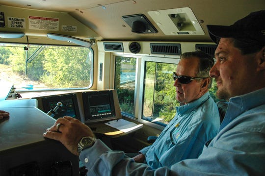 President George H.W. Bush in the cab of UP locomotive No. 4141.