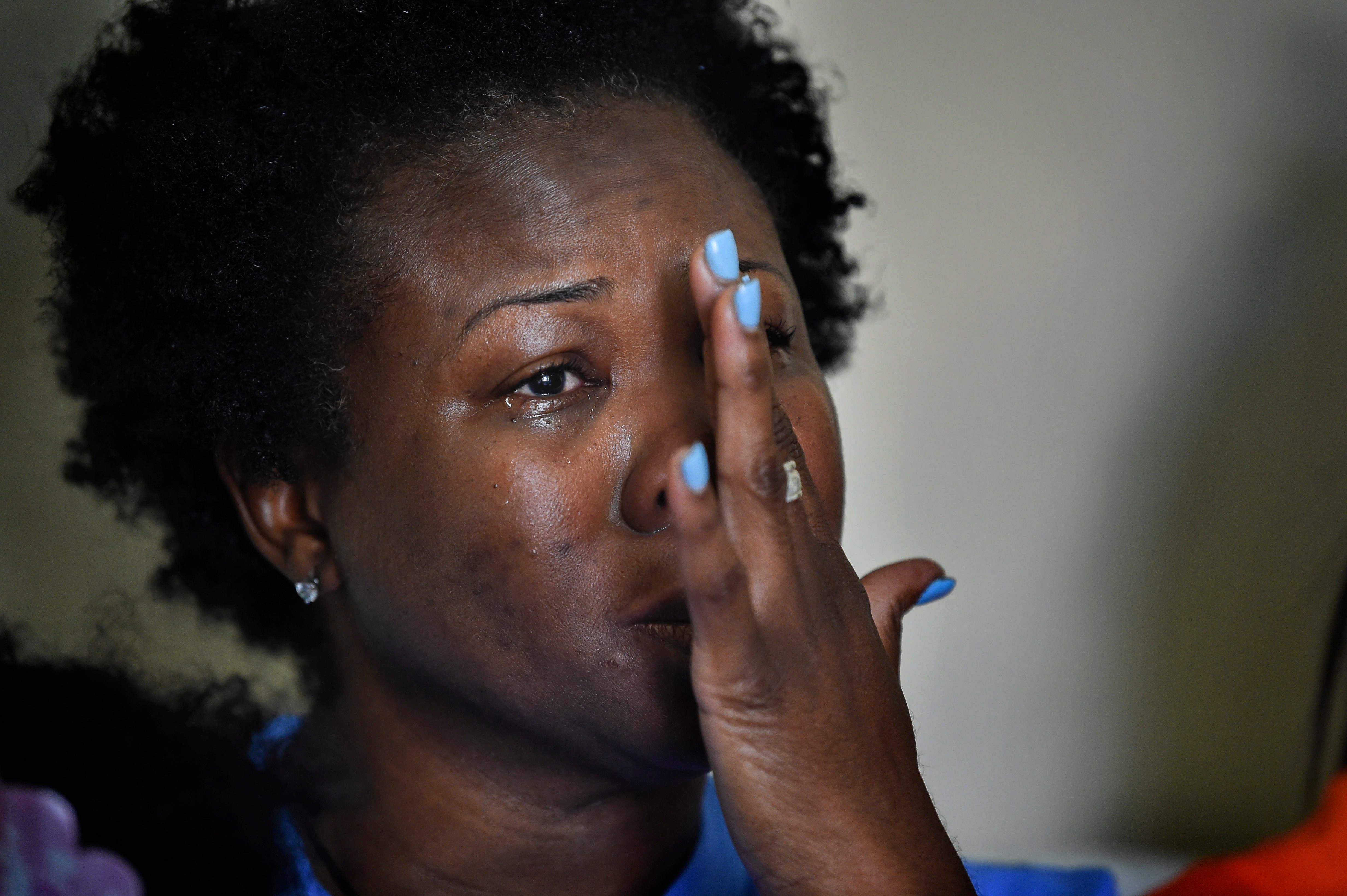 Shaundelle Brooks, the mother of Waffle House shooting victim Akilah Dasilva, cries as she talks about the loss of her son.