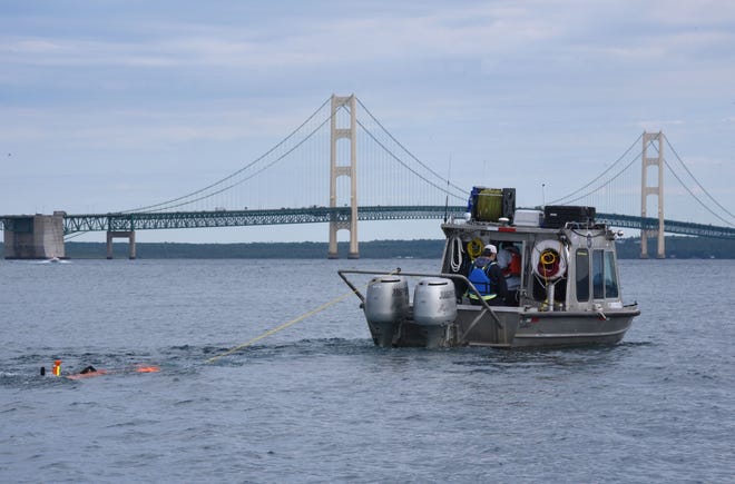 Oil pipeline operator Enbridge tows their autonomous underwater vehicle toward the Mackinac Bridge and west to inspect their controversial Line 5 under the Straits of Mackinac Wednesday, June 8, 2016. Using the autonomous underwater vehicle and a roving underwater vehicle over several days, the entire five-mile-long pipeline, which rests on supports along the bottom of Lake Michigan, will have been covered by both sonar and visual means.