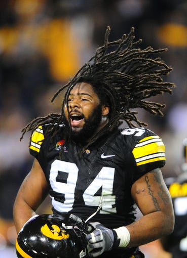 Dec. 28, 2010; Tempe, AZ, USA; Iowa Hawkeyes defensive lineman (94) Adrian Clayborn celebrates in the closing seconds of the game against the Missouri Tigers in the 2010 Insight Bowl at Sun Devil Stadium. Iowa defeated Missouri 27-24. Mandatory Credit: Mark J. Rebilas-USA TODAY Sports