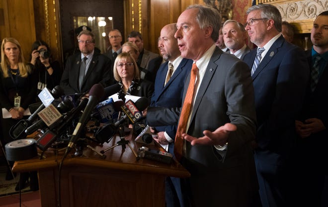 Surrounded by members of his caucus, Assembly Leader Robin Vos, R-Rochester, speaks to reporters Tuesday, Dec. 4, 2018, at the Capitol in Madison, Wis.