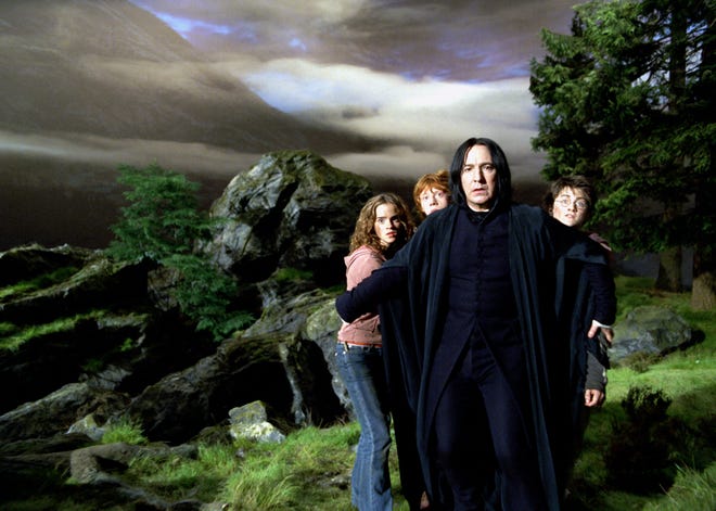 Professor Snape (Alan Rickman, center) shielfds Hermione (Emma Watson, from left), Ron (Rupert Grint) and Harry (Daniel Radcliffe) in "Harry Potter and the Prisoner of Azkaban."