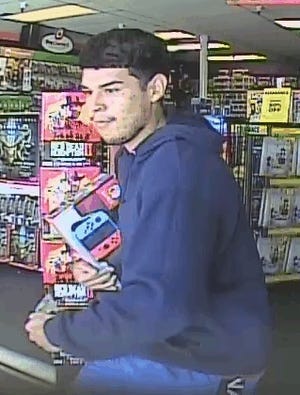 Pima County sheriff's officials seek the public's help to identify a man who is suspected of taking a video game console from a GameStop in Tucson.