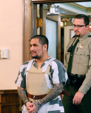 Zachary Paul Koehn enters the courtroom for sentencing in Waterloo, Iowa Tuesday, Dec. 4, 2018. The Waterloo-Cedar Falls Courier reports Judge Richard Stochl on Tuesday sentenced 29-year-old Koehn to life sentence without parole, as was mandatory under state law. Koehn was convicted earlier of first-degree murder in the death of his son, 4-month-old Sterling Koehn, who was found in a maggot-infested baby swing last year.  (Jeff Reinitz/The Courier via AP)