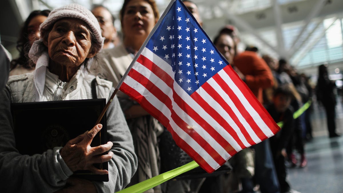 Ana Julia Ayala, an immigrant from El Salvador, waits for her son to depart a naturalization ceremony on March 20, 2018, in Los Angeles, California. The naturalization ceremony welcomed more than 7,200 immigrants from over 100 countries who took the citizenship oath and pledged allegiance to the American flag.