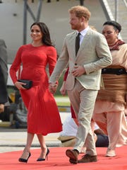 Prince Harry and Duchess Meghan of Sussex arrive in Tonga on Oct. 25, 2018, as part of their three-week royal tour of Down Under.