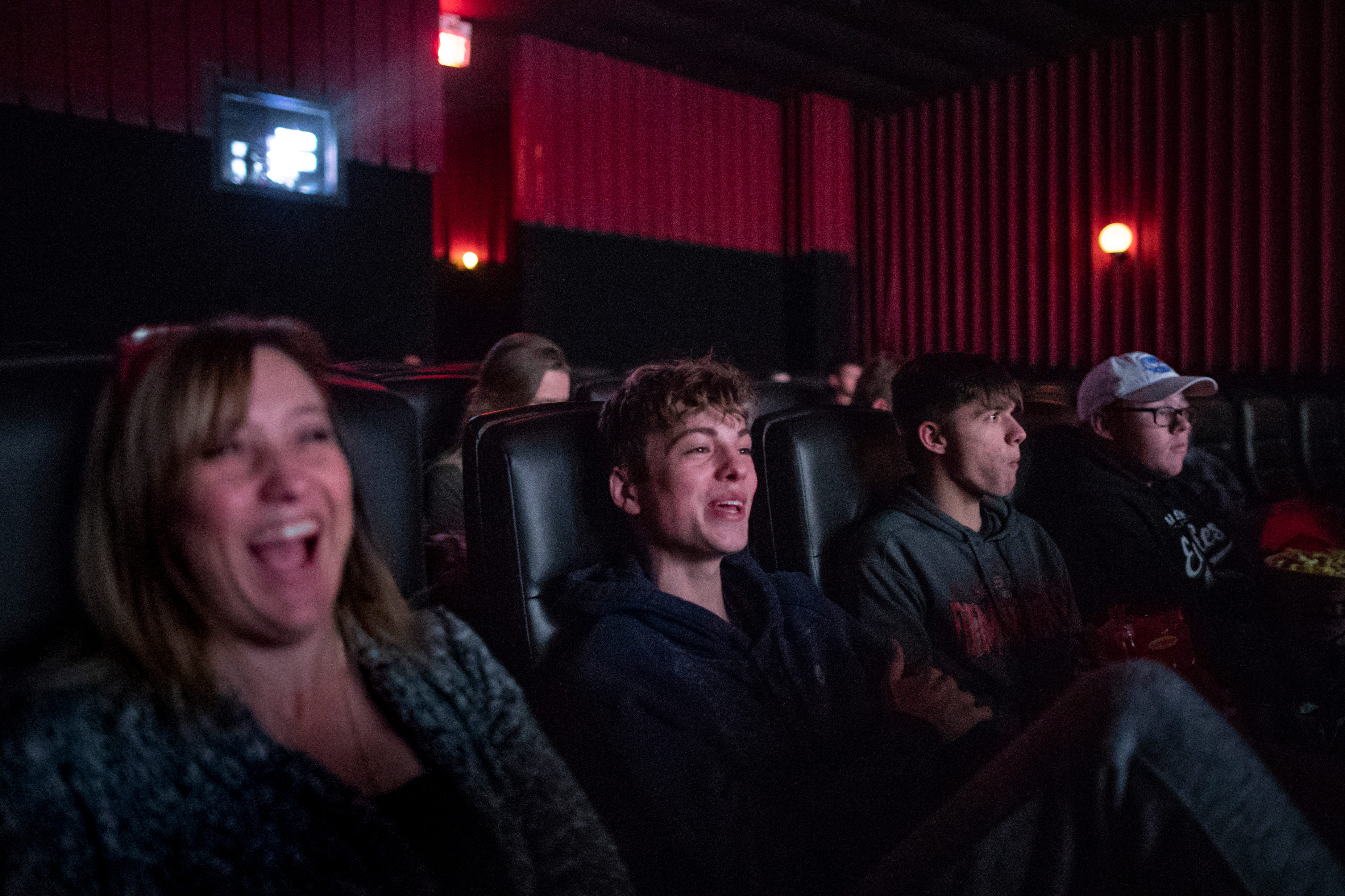 Austin show choir teacher Kathy Risk-Sego, from left, laughs at a movie with show choir members Nolan Lytle, Keegan Young and Bentley Mahaney during a team outing to Madison, Indiana. Oct. 19, 2018 