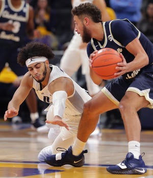 Marquette guard Markus Howard (0) lunges for the ball held by Charleston Southern forward Travis McConico (1) during the first half of their game Tuesday, November 28, 2018 at Fiserv Forum in Milwaukee, Wis. 

MARK HOFFMAN/MHOFFMAN@JOURNALSENTINEL.COM