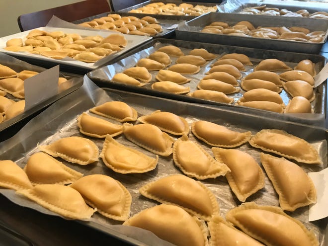 After boiling, pierogis should be placed on trays in a single layer.