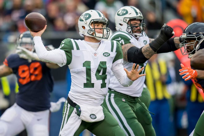 New York Jets quarterback Sam Darnold (14) passes against the Chicago Bears during the first half at Soldier Field.