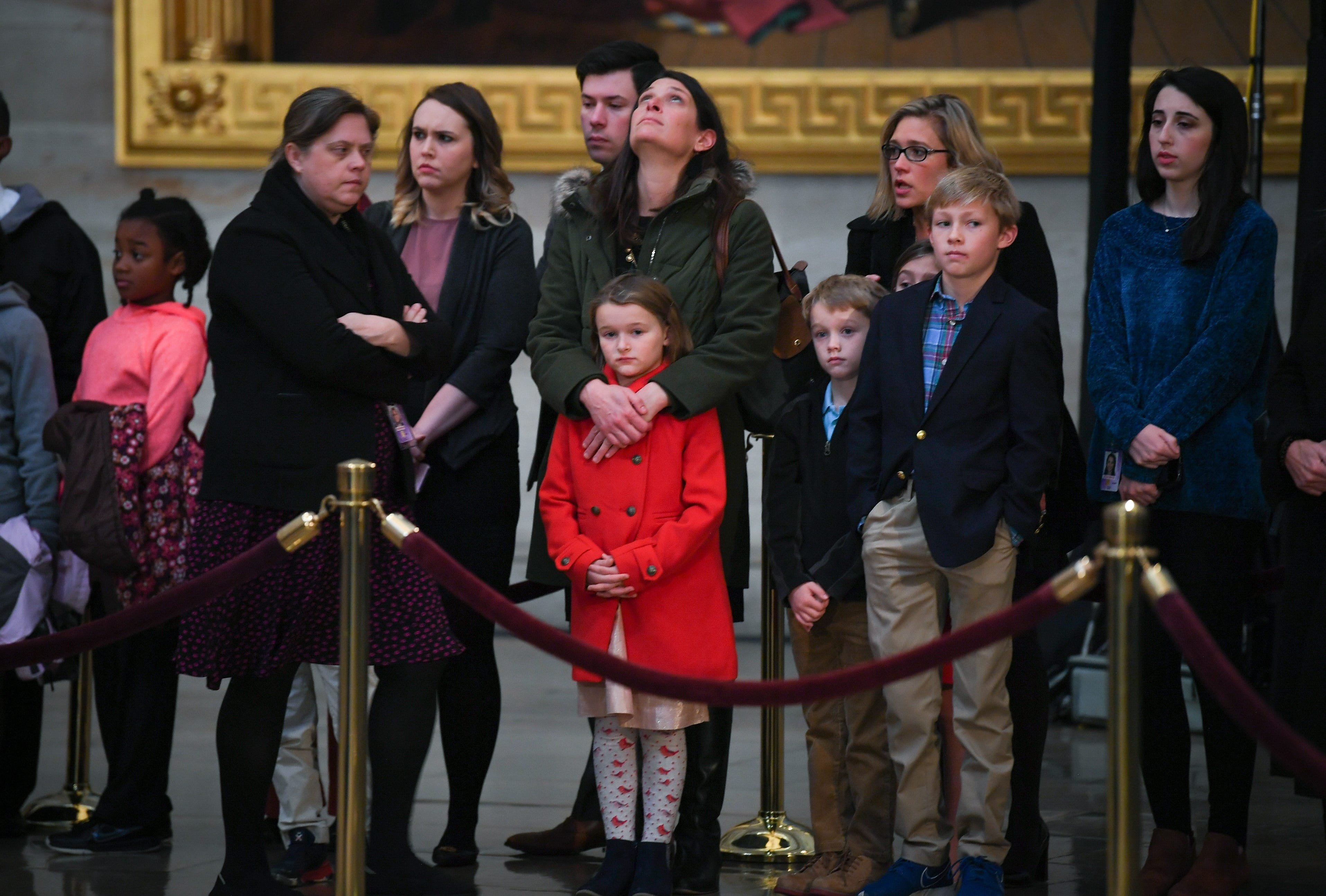 Visitors to the Capitol Rotunda pay respects to President George H.W. Bush, the 41 President and 32nd person to lie in state, Dec. 4, 2018. 