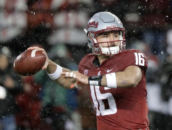 In this Nov. 23, 2018, file photo, Washington State quarterback Gardner Minshew passes against Washington during the first half of an NCAA college football game in Pullman, Wash. Minshew was named the Pac-12 offensive player of the year and the newcomer of the year Thursday, Dec. 6, 2018.