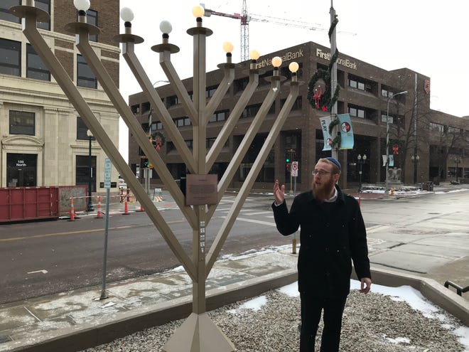 Rabbi Mendel Alperowitz leads a menorah lighting in front of the Wells Fargo building in downtown Sioux Falls.