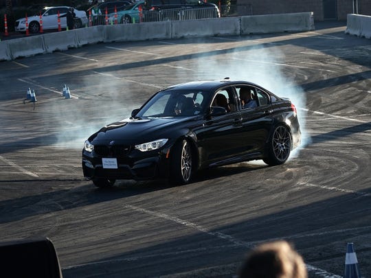 A driver demonstrates drifting with a BMW M5 during CES 2018 in January in Las Vegas, a week before Detroit's auto show.