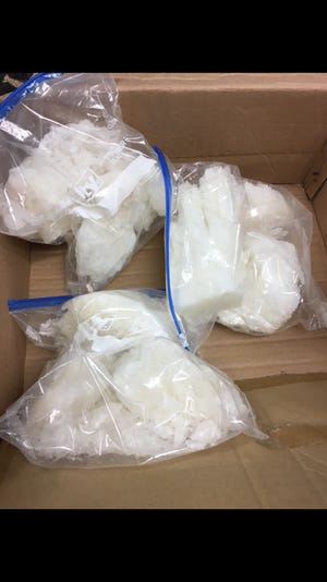Officers seized a cardboard box containing a 6.5 pounds of methamphetamine, with a street value of $595,600, during a traffic stop Thursday.