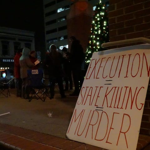 Seven people gathered in Market Square Thursday...