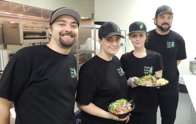 Some of the staff at the new Fresh Fire Grill in Redding: Eric Suter, left, Laura Peyton, Destiny Wood and Levi Silva.
